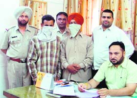 The accused, Satjeet Singh and Somnath, in police custody in Ludhiana