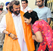 Singer and SAD-BJP candidate from Jalandhar Hans Raj Hans campaigns in a village near Phillaur.