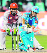 Mumbai Indians Jean-Paul Duminy (R) plays a shot as Kings XI Punjabs wicketkeeper Kumar Sangakkara looks on during their IPL Twenty20 match at The Kingsmead Cricket Stadium in Durban on Wednesday
