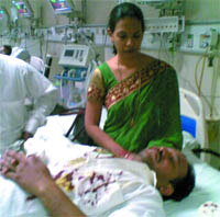 Sunil Jindal undergoes treatment at the RML Hospital in New Delhi on Thursday. His wife Sarita Jindal is also seen.