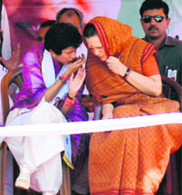 Congress president Sonia Gandhi and party candidate for the Ambala Lok Sabha seat Kumari Selja share a point at an election rally in Ambala on Thursday.