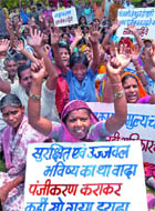 Construction workers protest against the dysfunctional status of Delhi Building and other construction workers welfare board outside the labour commissioners office at Civil Line in New Delhi on Friday.
