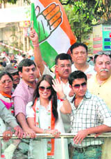 Mahima with Congress workers at a roadshow in Dehradun on Friday.