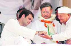 Congress general secretary Rahul Gandhi with party candidate for the Gurgaon LS seat Rao Inderjeet Singh (centre) and Haryana Congress president Phool Chand Mullana at a poll rally in Nuh (Mewat) on Friday.