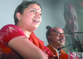 STAR POWER: TV star and BJP leader Smriti Irani with Vijay Goel addresses a press conference in New Delhi