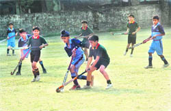 Youngsters slug it out during the match in Dehradun on Saturday.
