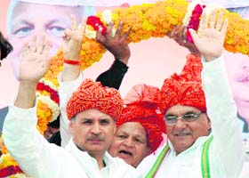Congress candidate from Gurgaon Rao Inderjeet Singh (left) with Chief Minister Bhupinder Singh Hooda duirng a road show in Badshahpur village in Gurgaon district