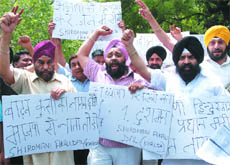 Members of the Shiromani Akali Dal (Khalsa) shout slogans during a demonstration against BJP's prime ministerial candidate L.K. Advani over some contents of his book, at Jantar Mantar in New Delhi on Sunday.