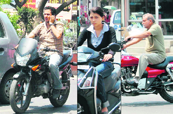 The young and old alike flout road safety rules while riding two-wheelers in Dehradun.