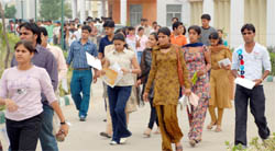 Students come out from an examination centre after appearing for the MAT exam in Gurgaon on Sunday.