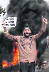 This youth shouts slogans during a protest in Jammu on Sunday against the demolition of 11 houses belonging to Sikhs by the Taliban in Pakistan