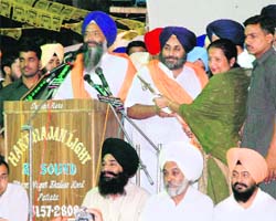 Deputy Chief Minister Sukhbir Singh Badal with SAD candidate Prem Singh Chandumajra