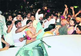 A damaged car of Amrit Tewari, the mother of Manish Tewari, in Ludhiana on Sunday.