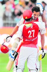 Kings XIs Mahela Jayawardene congratulates Irfan Pathan after their win over Kolkata Knight Riders on Sunday.
