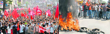 Nepal Maoist supporters take out a victory rally in support of the Maoist governments decision to sack the army chief, in Kathmandu on Sunday; and  Nepalese student activists affiliated to Nepals main opposition political party, Nepali Congress, burn tyres and shout anti-government slogans.