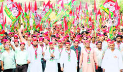 Samajwadi Party candidate Ambrish Kumar attends a roadshow in Haridwar