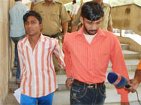 Police takes an alleged serial killer to the district court in Gurgaon on Monday.