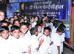 Students at the 3-D film fantasy hall in Kurukshetra.
