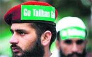 Supporters of the Sunni Tehreek take part in an anti-Taliban and anti-US march in Islamabad on Monday. Pakistani forces battled Taliban fighters as militants denounced the army and the government as US stooges and said a peace pact would end unless the government halted its offensive