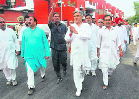 Congress candidate Pawan Bansal during their election campaigns in Chandigarh on Tuesday.