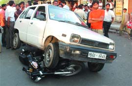 A Maruti car, which ran over a motorcycle, in Jalandhar on Tuesday.