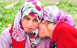 Villagers mourn in Bilge village, the scene of a massacre, in southeast Turkey's Mardin province