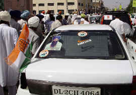 A car with posters of Jarnail Singh Bhindrawale and Congress leaders Sonia Gandhi and Captain Amarinder Singh during a poll campaign of Sukhwinder Singh Danny who is contesting the Lok Sabha elections from Faridkot constituency.