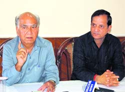 Senior BJP leader Shanta Kumar along with minister for transport Kishan Kapoor addressing a press conference at Dharamsala on Wednesday
