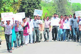 Students take out a rally on the Punjab Agricultural University campus in Ludhiana