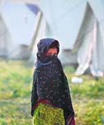 Seeking safety: A Pakistani girl, fleeing military operations in Buner, stands on the grounds of a UNHCR camp in Mardan, about 100 km northwest of Islamabad, on Wednesday