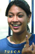 A first-time voter shows her inked finger in New Delhi on Thursday.