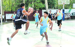 A match being played at the state-level junior basketball tournament in Dehradun on Thursday.