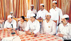 All-India Congress Sewa Dal president Mahinder Joshi with other workers talking to mediapersons at Shimla