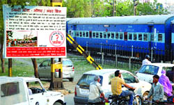 A hoarding erected by the welfare societies of varoius localities seeking an ROB or RUBs at Gazi Gulla and Ram Nagar crossings in Jalandhar