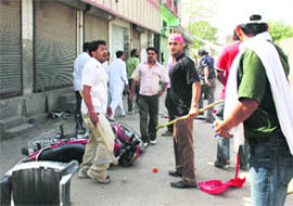 Supporters of the SAD and the Congress after a clash at the Grain Market in Bathinda