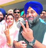 SAD chief Sukhbir Badal and his wife Harsimrat Kaur Badal show ink marks in Bathinda
