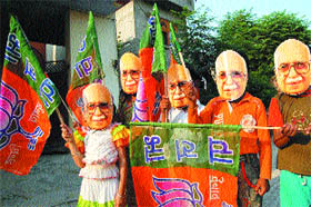 Children wear masks of BJPs prime ministerial candidate L.K. Advani.