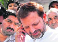 Congress candidate Arvind Sharma with supporters in Karnal on Friday.