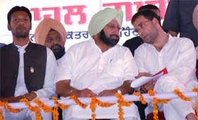 AICC general secretary Rahul Gandhi and Congress campaign committee chairman Amarinder Singh sharing a point during a rally in Moga