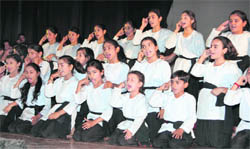 Schoolchildren perform at a function organised on World Red Cros Day at Abhinav Theatre in Jammu on Saturday.