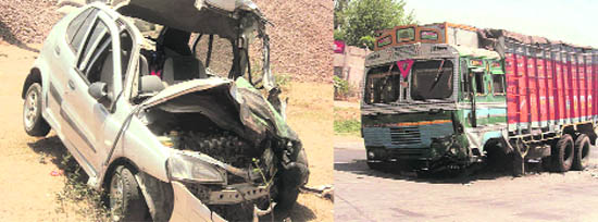 Mangled remains of the car which collided with a truck on NH 95 near Khanpur village.