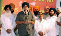 Chief Minister Parkash Singh Badal addressing a rally in favour of SAD candidate Paramjit Kaur Gulshan in Moga on Sunday.