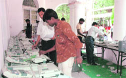 Electronic voting machines being checked for the final time before being desptached from Dehradun on Sunday.