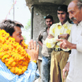BJP candidate from Hamirpur Anurag Thakur campaigns in Haripur Guler village on Sunday.