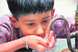 With mercury rising high, a child quenches his thirst in Gurgaon on Sunday. 