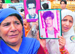 A Kashmiri mother weeps for her disappeared kin during a dharna in Srinagar on Sunday.