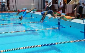 Contestants take the plunge during a swimming competition at Baba Ganganath pool in Sector-14 in Gurgaon