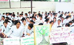 Students of Guru Ram Rai Institute of Medical and Health Sciences hold a demonstration against fee hike in Dehradun