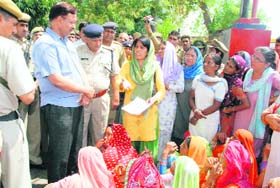 Members of the Janwadi Mahila Samiti stage a protest in Hisar on Monday in protest against the murder of a woman