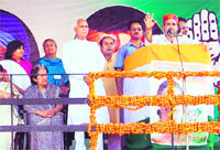 Congress general secretary Rahul Gandhi addressing the gathering at Rehan in Kangra district on Monday. 